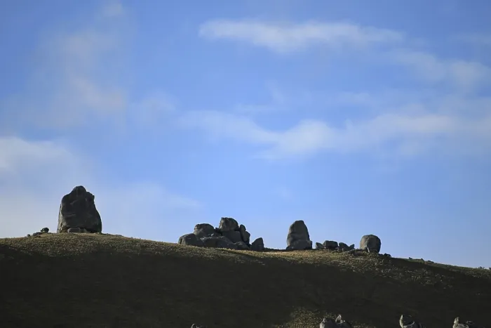 Framed Print : Cloud formations waft over the rocky landscape at Castle Hill