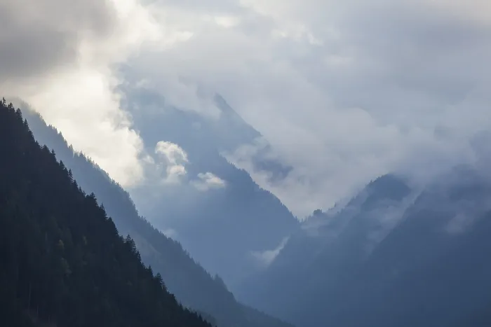Framed Print : Cloudy atmosphere with forest and mountains