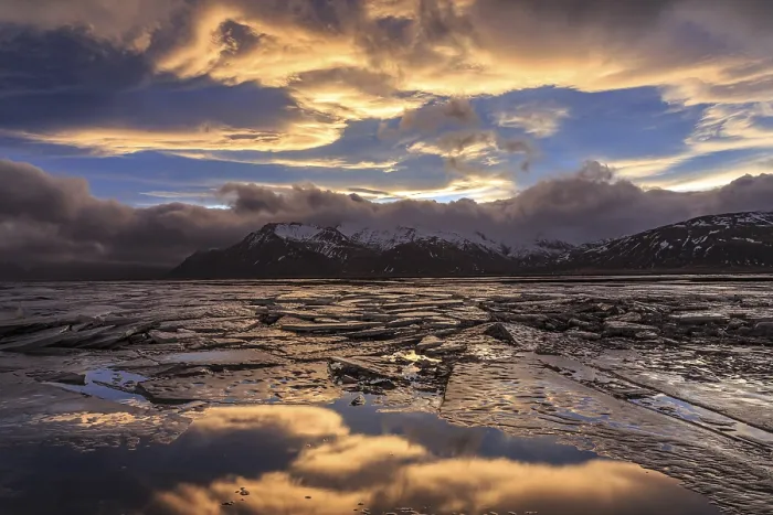 Framed Print : Cloudy mood and evening light over a fjord