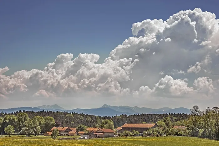 Framed Print : Cluster clouds (cumulus) over Alpine chain near Munich