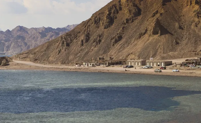 Framed Print : The coastline of the Red Sea with small resorts and the mountains in the background Framed Print : The coastline of the Red Sea with small resorts and the mountains in the background