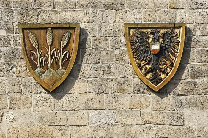 Framed Print : Coat of arms for the Free Imperial City of Dinkelsbuehl next to the Imperial Eagle