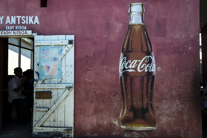 Framed Print : Coca Cola advertising and the open door of a restaurant Framed Print : Coca Cola advertising and the open door of a restaurant