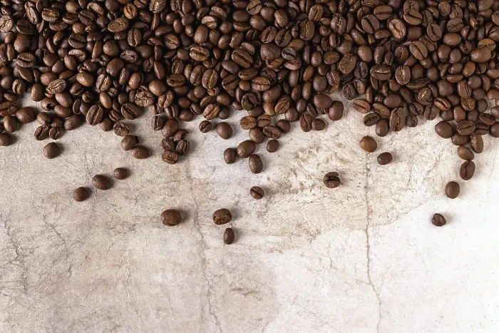 Framed Print : Coffee grains scattered on vintage paper Framed Print : Coffee grains scattered on vintage paper