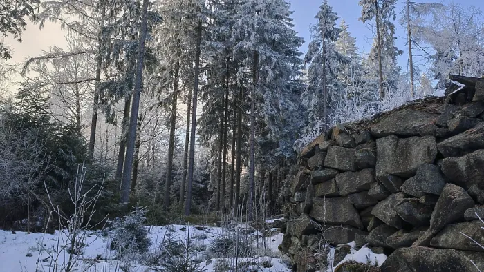 Framed Print : Cold winter picture with a pile of stones in the forest