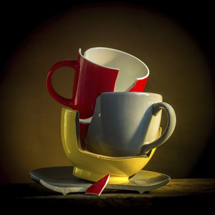 Framed Print : A collection of broken tableware is displayed