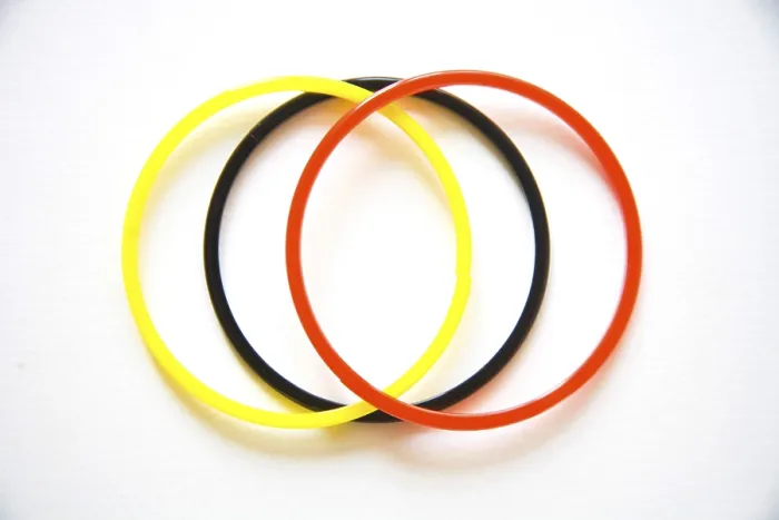 Framed Print : Three color orange, black and yellow glass bangles woman ornament