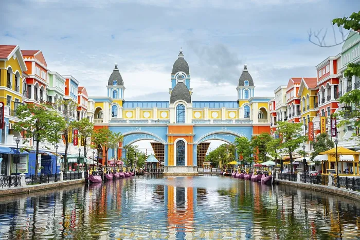 Framed Print : Colorful buildings lining a canal creating a symmetrically vibrant and picturesque scene Framed Print : Colorful buildings lining a canal creating a symmetrically vibrant and picturesque scene