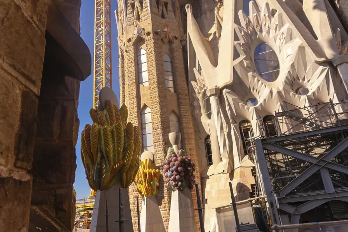 Framed Print : Colorful ceramic pinnacles and construction crane are visible at sagrada familia in barcelona