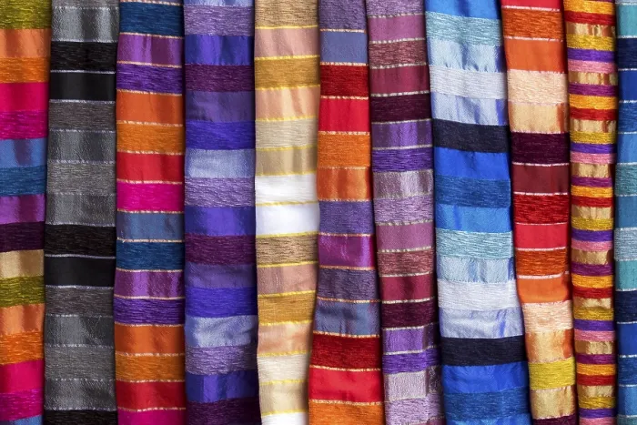 Framed Print : Colorful striped cloths for sale at the street stall