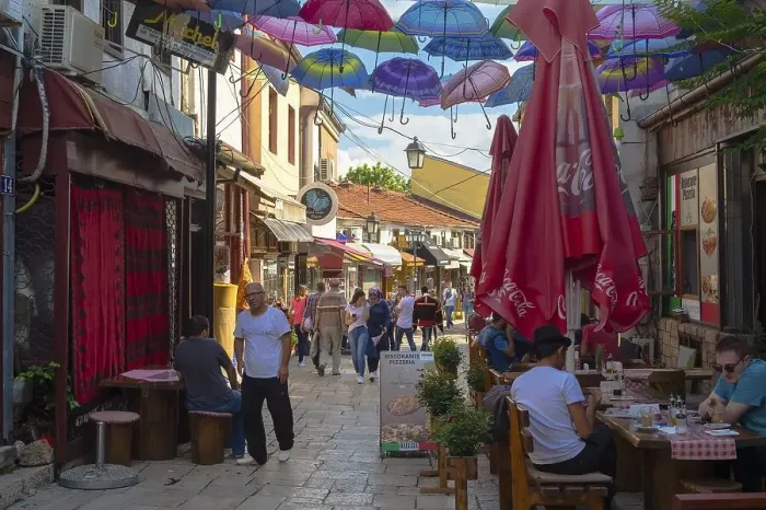Framed Print : Colorful umbrellas hanging in a street Framed Print : Colorful umbrellas hanging in a street