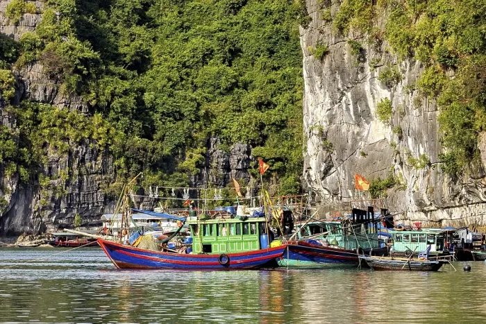 Framed Print : Colourful fishing boats lean against each other in the water Framed Print : Colourful fishing boats lean against each other in the water