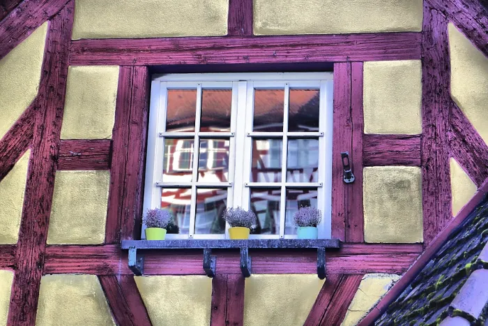 Framed Print : Colourful half-timbered house window with flower pots Framed Print : Colourful half-timbered house window with flower pots
