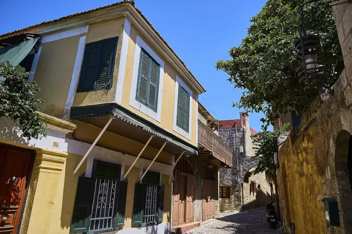 Framed Print : Colourful house facades with shutters in a historic alley Framed Print : Colourful house facades with shutters in a historic alley