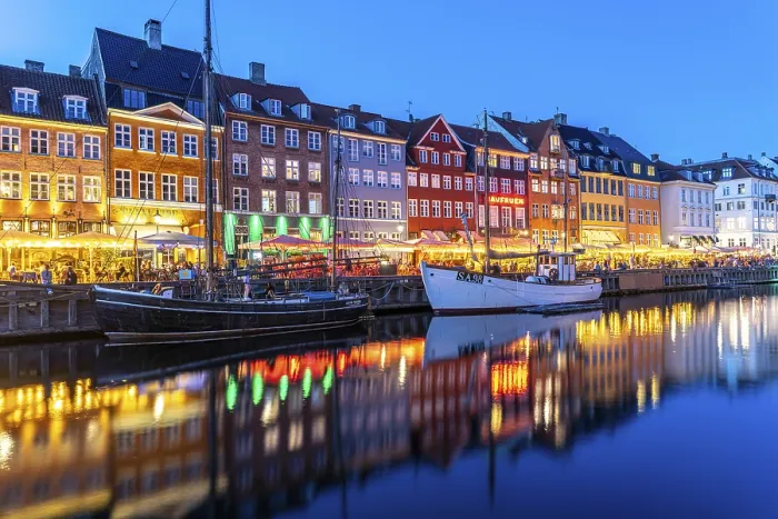 Framed Print : Colourful houses, restaurants and historic ships on the Nyhavn canal and harbour at dusk