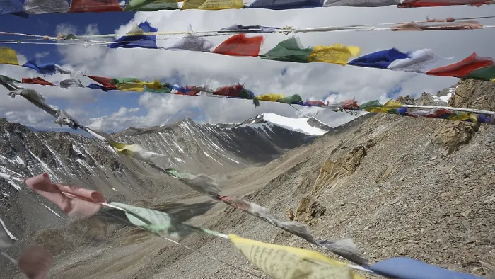 Framed Print : Colourful prayer flags flutter against a high-mountain backdrop