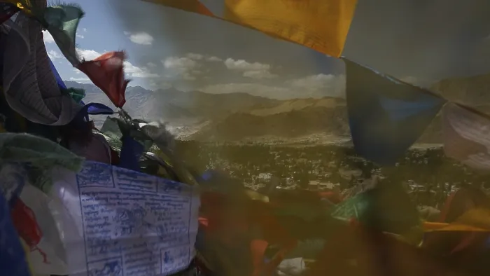 Framed Print : Colourful prayer flags fly against a vast mountain landscape and blue sky with clouds Framed Print : Colourful prayer flags fly against a vast mountain landscape and blue sky with clouds