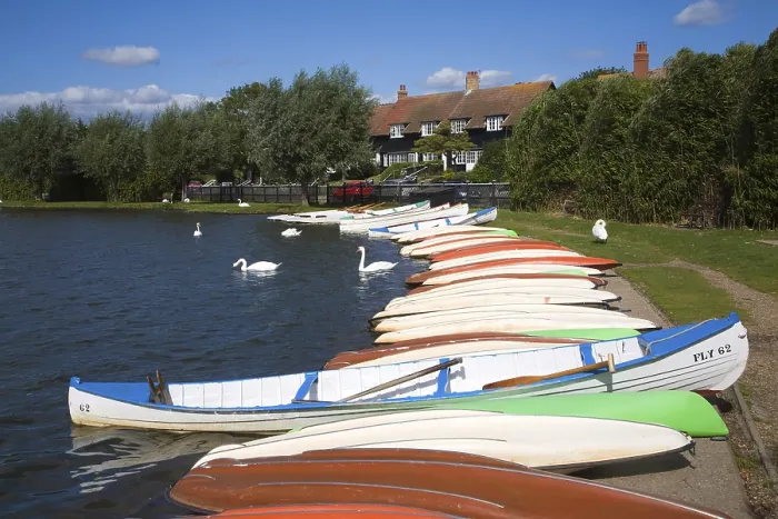 Framed Print : Colourful rowing boats on the Meare boating lake