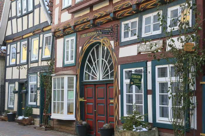 Framed Print : Colourfully painted facade of a 16th century half-timbered house in BackerstraBe Framed Print : Colourfully painted facade of a 16th century half-timbered house in BackerstraBe