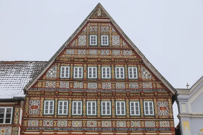 Framed Print : Colourfully painted half-timbered house on the market square