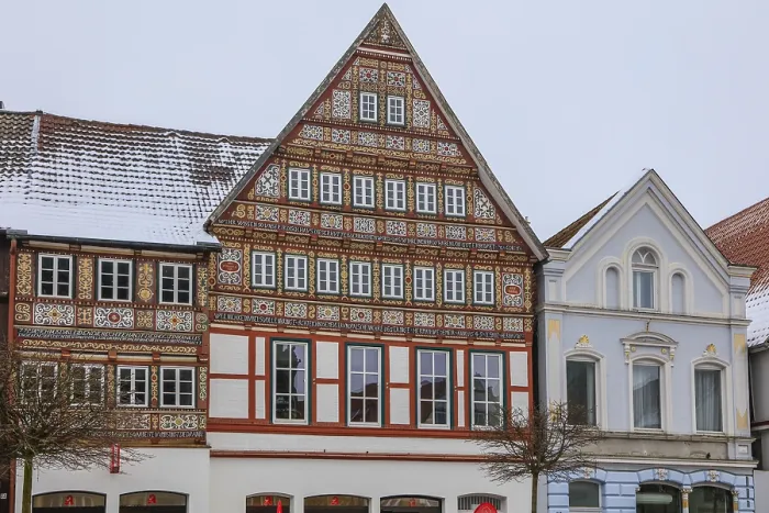 Framed Print : Colourfully painted half-timbered house on the market square