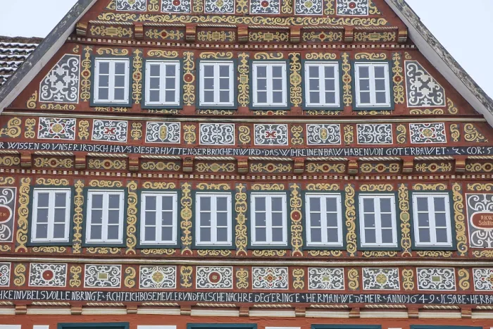 Framed Print : Colourfully painted half-timbered house on the market square