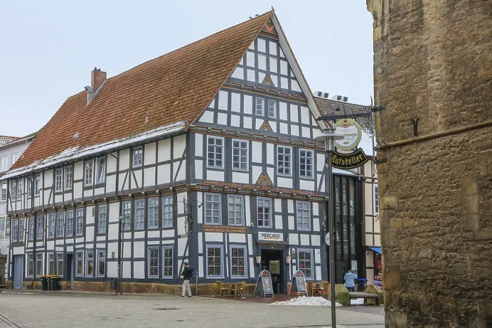 Framed Print : Colourfully painted half-timbered house on the market square