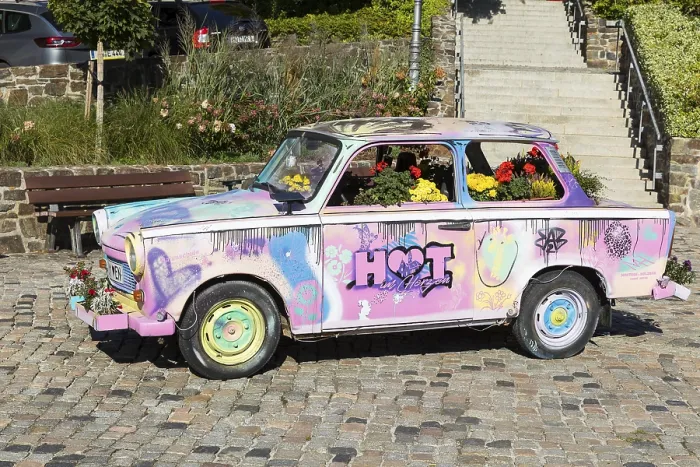Framed Print : Colourfully painted and planted Trabant car on the old market in Hohenstein-Ernstthal