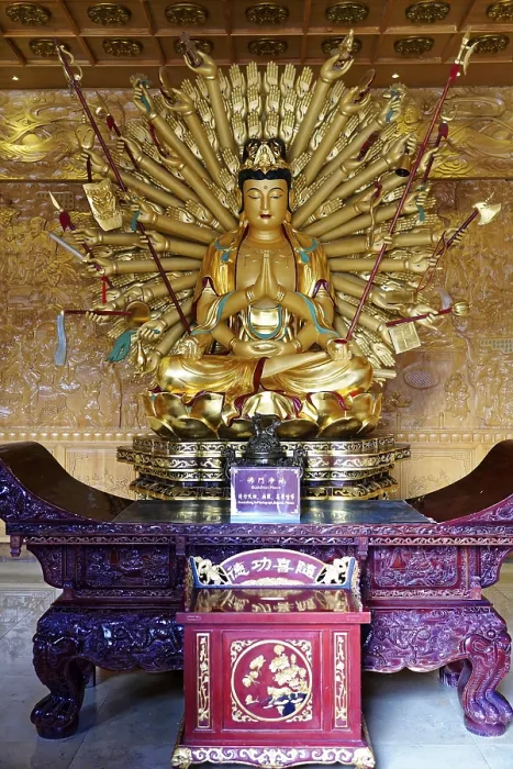 Framed Print : Complex golden Buddha statue with numerous arms in an ornate room Framed Print : Complex golden Buddha statue with numerous arms in an ornate room