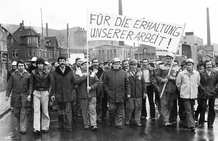 Framed Print : The concern for their jobs is written all over the faces of the workers