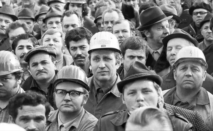 Framed Print : The concern for their jobs is written all over the faces of the workers Framed Print : The concern for their jobs is written all over the faces of the workers