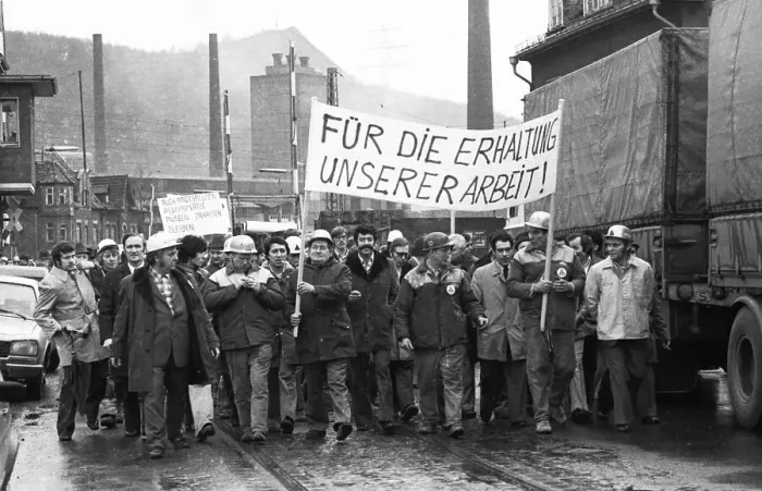 Framed Print : The concern for their jobs is written all over the faces of the workers