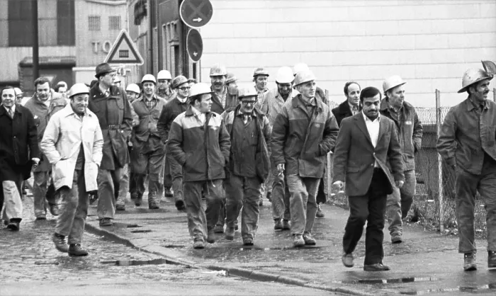 Framed Print : The concern for their jobs is written all over the faces of the workers