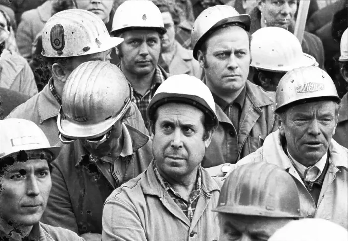 Framed Print : The concern for their jobs is written all over the faces of the workers