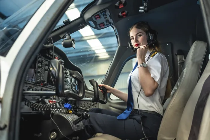 Framed Print : Confident female pilot preparing for takeoff Framed Print : Confident female pilot preparing for takeoff