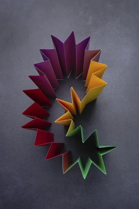 Framed Print : Construction of colored paper on a dark background