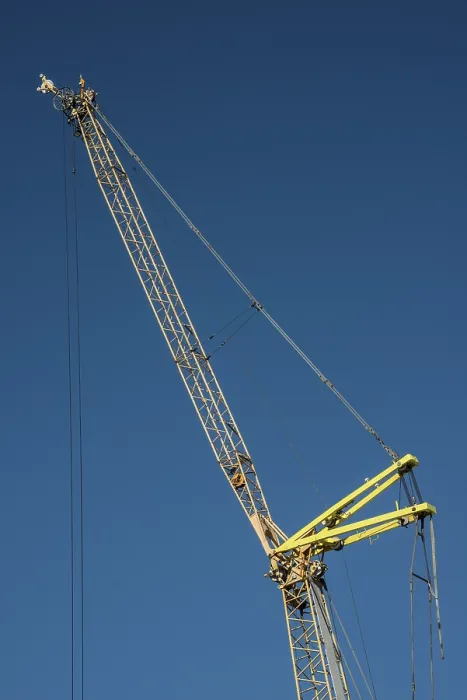Framed Print : Construction crane against blue sky in Ystad