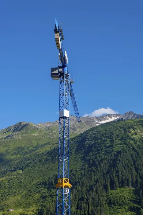 Framed Print : Construction Crane and swiss Alps with Blue Clear Sky and Sunlight in Andermatt Framed Print : Construction Crane and swiss Alps with Blue Clear Sky and Sunlight in Andermatt