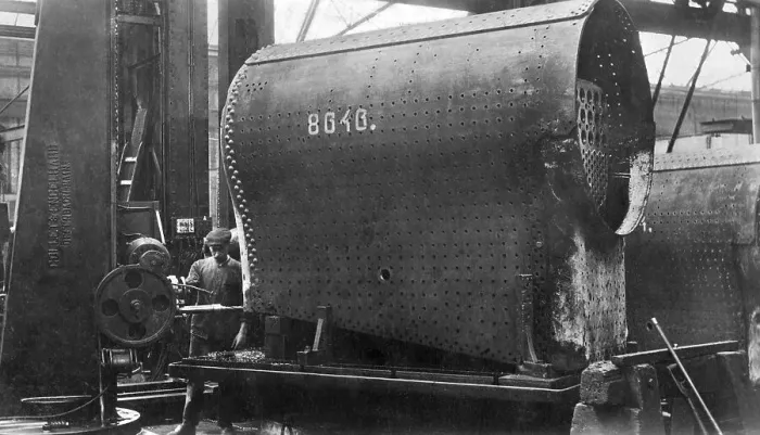 Framed Print : Construction of a locomotive, drilling stud holes on the boiler