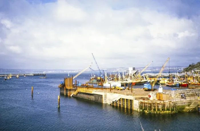 Framed Print : Construction of the new outer harbour, Brixham, Devon, England, UK 1986 Framed Print : Construction of the new outer harbour, Brixham, Devon, England, UK 1986