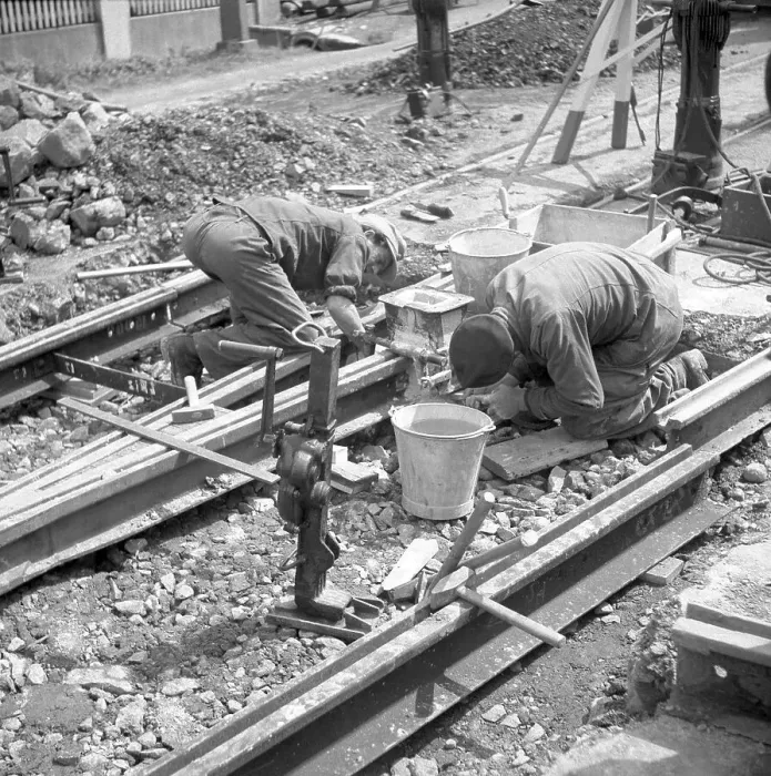 Framed Print : Construction workers laying tracks