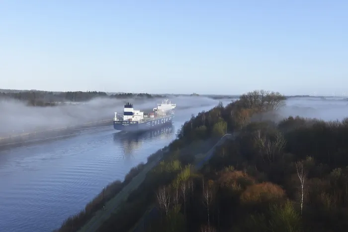 Framed Print : Container ship CMA CGM TIVOLI sailing in fog in the Kiel Canal