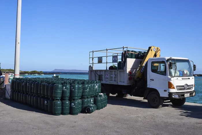 Framed Print : Container being unloaded, cargo consists of gas cylinders