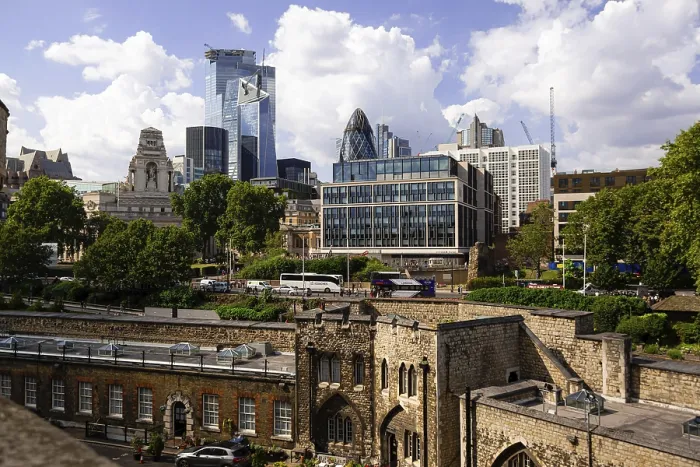 Framed Print : Contrast of modern skyscrapers against historic architecture under a cloudy sky at The Tower of London