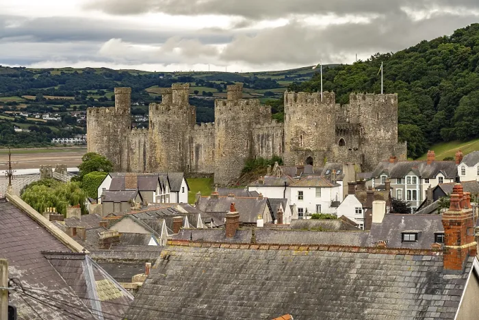Framed Print : Conwy Castle and the roofs of the old town centre in Conwy