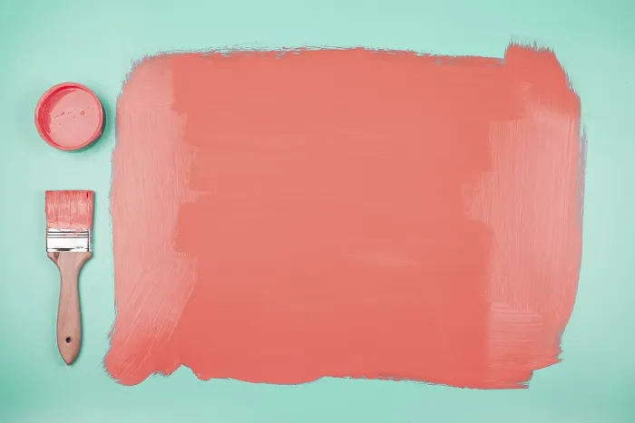 Framed Print : Coral paint can paintbrush with painted teal background