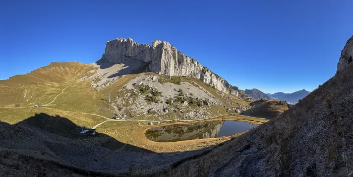 Framed Print : Cottage on Lac d'Ai below Tour d'Ai rock face Framed Print : Cottage on Lac d'Ai below Tour d'Ai rock face