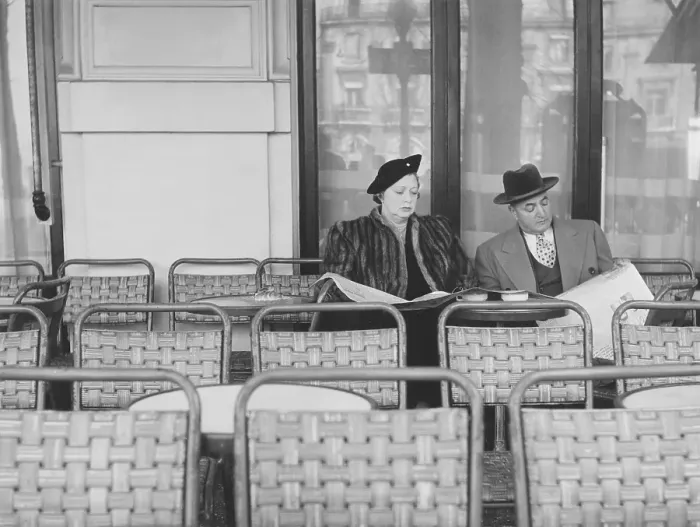 Framed Print : Couple in the 1950s. A couple pictured sitting in chair on an outdorr cafe Framed Print : Couple in the 1950s. A couple pictured sitting in chair on an outdorr cafe
