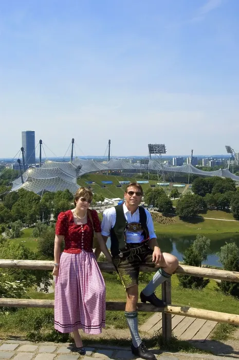 Framed Print : Couple in Bavarian traditional costume in front of Olympic Stadium Framed Print : Couple in Bavarian traditional costume in front of Olympic Stadium