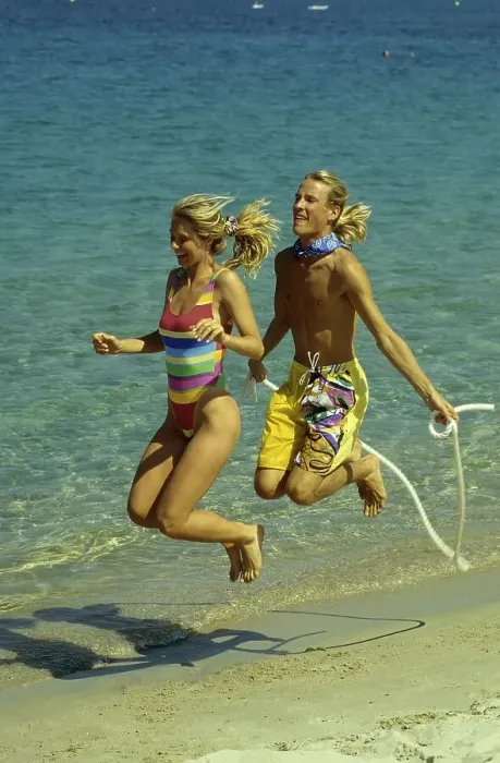 Framed Print : Couple on the beach, beach running and jumping rope